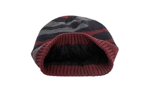 Close-up of the thick black fleece lining inside the striped knit beanie for winter warmth