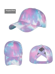Three-way view of tie-dye purple and pink baseball cap with criss-cross ponytail opening