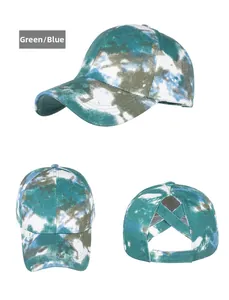 Detail view of tie-dye baseball cap with criss-cross back for high ponytails