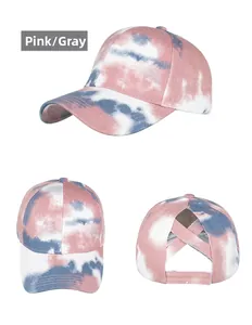 Detailed views of tie-dye baseball cap with pink and grey patterns and criss-cross back