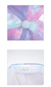 Detail view of tie-dye baseball cap showing 100% cotton fabric and internal stitching