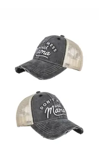 Detail of distressed ponytail trucker hat with Don't Mess with Mama embroidery