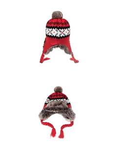 Detail view of red winter hat featuring nordic pattern and thick grey faux fur lining