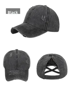 Close-up of washed distressed cotton baseball cap with elastic criss-cross ponytail back