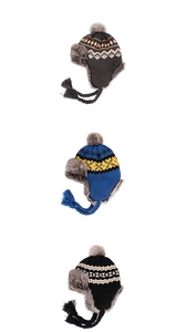 Detailed view of three knit trapper hats with pom-poms and warm faux fur lining