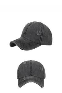 Detailed views of washed grey denim baseball cap with distressed rip effects and embroidery