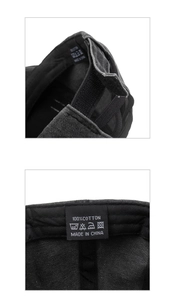 Detail view of cotton baseball cap showing elastic cross bands and wash care label
