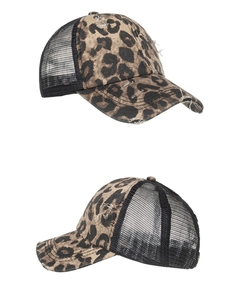Detail of leopard print criss-cross ponytail cap with distressed mesh back design