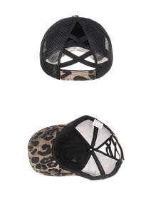 Detail of leopard print ponytail baseball cap showing elastic cross bands and mesh