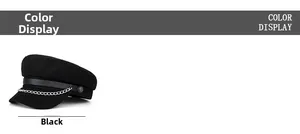 Detail of black wool nautical baker boy hat with leather strap and silver metal chain link