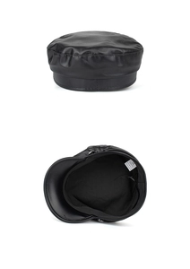 Internal details of black PU newsboy cap showing lining and adjustable strap