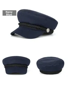 Three-way view of navy blue wool baker boy hat with braided cord and anchor buttons