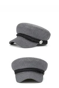 Side view of gray newsboy cap with black braided rope and silver metal buckle detail