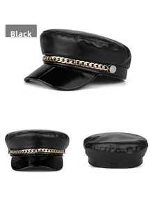 Detail view of black PU leather baker boy hat with gold chain and matte finish