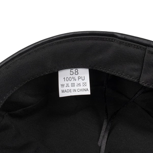 Internal view of black PU leather beret showing size 58 label and quality lining