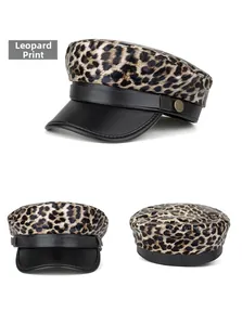 Detail view showing leopard print newsboy cap with black PU leather brim and gold buttons