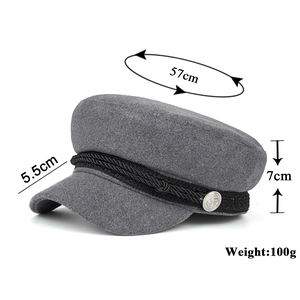 Grey wool blend newsboy cap with black braided strap and silver anchor button detail