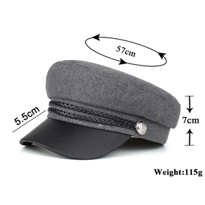 Vintage dark gray wool newsboy hat with black leather brim and size measurements