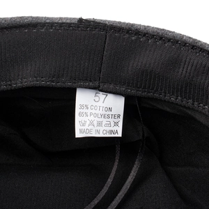 Three-color beret with black lining and 35% cotton 65% polyester material tag
