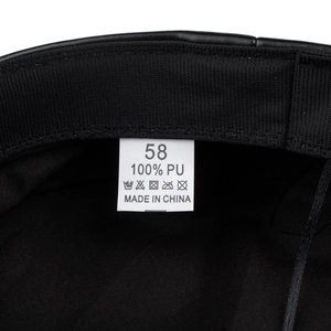 Interior detail of black PU leather beret with inner lining and size 58 wash label