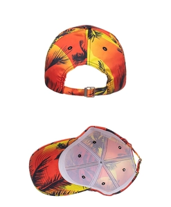 Macro view of adjustable metal buckle and stitching on tropical palm print baseball cap