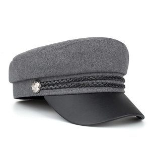 Stylish grey wool baker boy hat with black leather brim and silver metal button detail