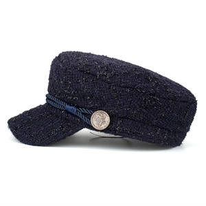 Classic dark blue tweed newsboy hat with braided trim and gold crown button detailing
