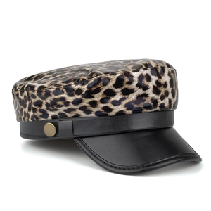Fashionable faux leather leopard print newsboy cap with black brim and gold button detail
