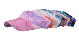Detailed row of tie-dye sun visors in various vibrant colors and patterns for summer