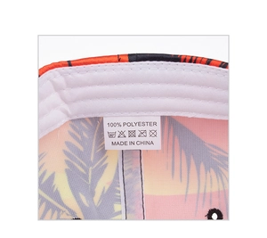 Detail view of tropical palm print satin lining and white sweatband inside baseball cap