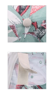 Detail of tropical floral baseball cap featuring crown top button and velcro strap