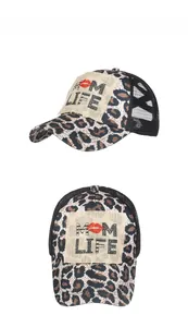 Detail view of leopard print ponytail baseball cap with MOM LIFE burlap patch and mesh back