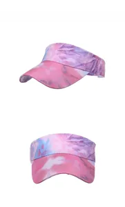 Detail view of tie-dye sun visor hat in pink and purple colors with curved brim