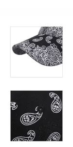Detail view of the black paisley pattern embroidery on a twill cotton baseball cap