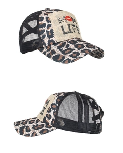 Detail view of Mom Life patch on leopard print trucker hat with breathable black mesh