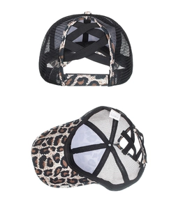 Detail of leopard print ponytail trucker hat with elastic criss-cross back and mesh