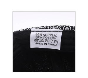 Detail of internal wash care label showing 80% acrylic 20% cotton material on baseball cap