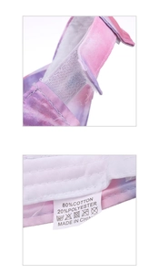 Detail of purple tie-dye sun visor showing 80% cotton label and velcro strap