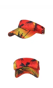 Detail view of tropical palm tree print sun visor hat with red yellow gradient finish