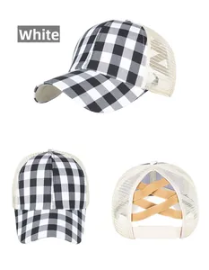 Detailed view of black and white plaid baseball cap with crisscross ponytail mesh back