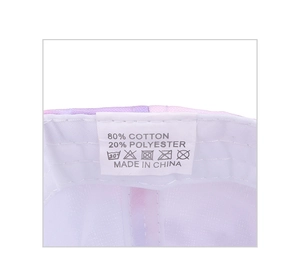 Detail view of tie-dye baseball cap interior with cotton fabric label and stitching