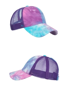 Detail of tie-dye baseball cap with purple breathable mesh and vibrant swirl pattern
