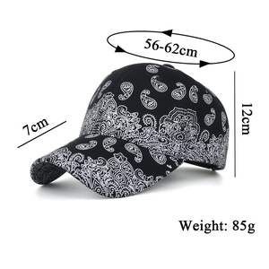 Classic black baseball cap with white paisley print and adjustable sizing details