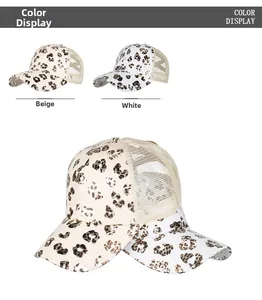 Detail view of leopard print mesh baseball caps in beige and white color options