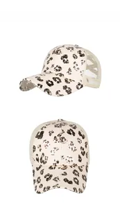 Detail view of leopard print trucker hat with breathable mesh and curved brim