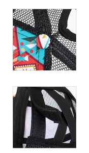 Detail showing geometric print fabric, breathable mesh, and criss-cross elastic ponytail straps
