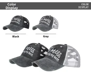Detail view of distressed trucker hats in black and grey with mess embroidery