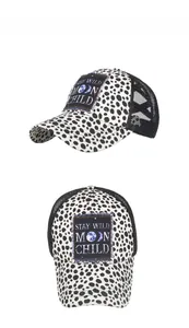 Detail of truck hat with leopard print, mesh back and Stay Wild Moon Child patch
