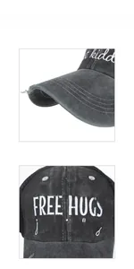 Close-up of distressed cotton baseball cap with embroidered Free Hugs slogan text