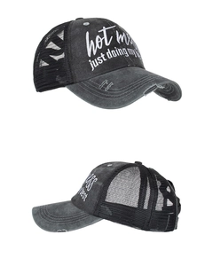 Detail of vintage washed charcoal trucker hat with Hot Mess embroidery and mesh back